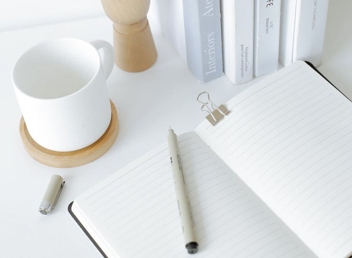 Miscellaneous desk items on a white desk