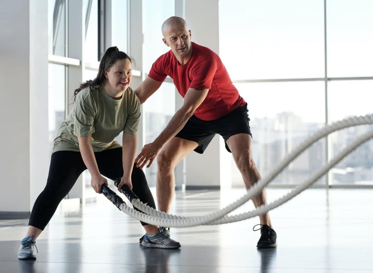 A person working out with a trainer