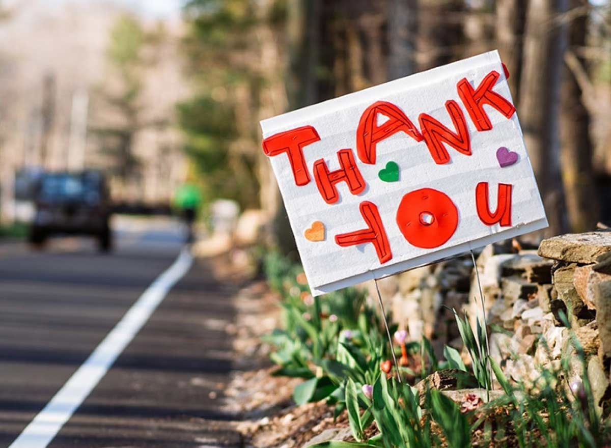 thank you sign on the side of street
